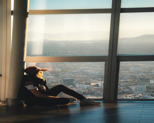 person working on a laptop beside a bright window in Chile